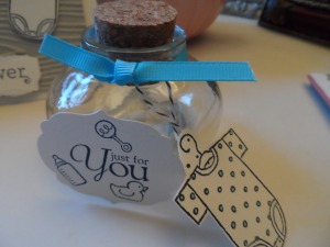 Recycled glass favor jar with Just for You tag and Onsie